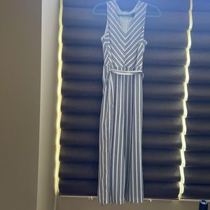 Black and white stripe jump suit with tie in back or front. Wide leg